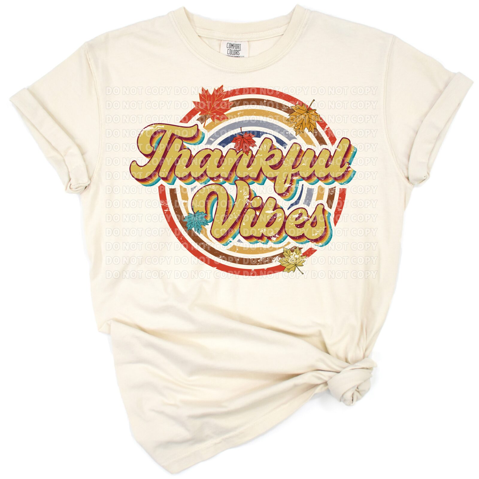 Retro style thankful vibes text with autumn leaves in warm fall colors.