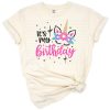 A cute pastel unicorn with floral accents and birthday elements for kids.