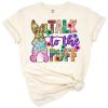 A cheerful bunny rabbit surrounded by Easter elements in pastel colors.