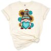 A whimsical western gnome with a serape hat surrounded by bright sunflowers and cute accents.