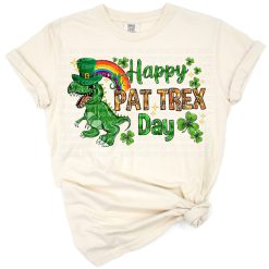 A cheerful T-Rex in festive green with a rainbow, celebrating St. Patrick’s Day.