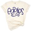 An eagle mascot with sports-themed elements for team shirts.