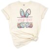 A cheerful Easter bunny with a colorful bow and glitter accents in a playful brushstroke style.
