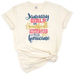 A colorful retro design featuring the phrase January girls are sunshine mixed with a little hurricane with playful elements.