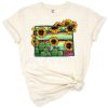 Illustrated Wyoming state map with sunflowers, cacti, and a colorful serape pattern.