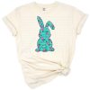 A green bunny silhouette with floral gold glitter accents and hand drawn details.