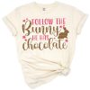 A cute bunny holding chocolate with playful Easter elements.