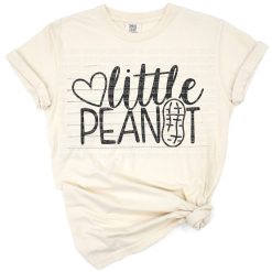 A cute cartoon peanut character with playful typography for a baby shirt.