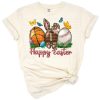 Smiling Easter bunny holding football, basketball, and baseball with festive holiday accents.