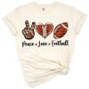 Grunge style football heart with peace and love symbols in an artistic arrangement.