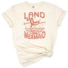 A retro-style illustration of a whimsical mermaid with boho summer accents and funny groovy details.