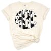 A set of stylized cow print monogram letters in a scalloped round and doodle style.