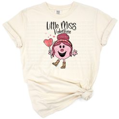 A cute cartoon girl surrounded by pink hearts and playful Valentine’s Day elements.