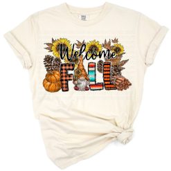 A group of fall pumpkins with cowhide accents arranged in an autumn scene.