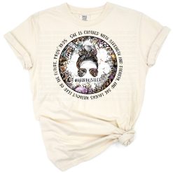 A messy bun mom with sunglasses and inspirational quote styled in retro salon graphics.