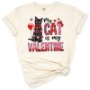 A playful cat surrounded by hearts in a Valentine’s Day theme.