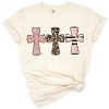 Three stylized crosses with rose glitter, leopard print, black stripes, and blush floral accents.