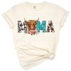 A cute western style longhaired cow with the word Mama in farmhouse boho theme.