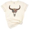 A rustic western bull skull with boho Aztec patterns and distressed artistic details.