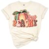 A watercolor peach with western cowgirl boho accents and fresh fruit details.