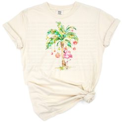 A pink flamingo stands by a decorated tropical Christmas tree in a retro holiday setting.