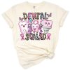 A cheerful tooth character with a pink ribbon and inspirational accents.