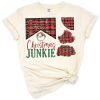 A playful Christmas junkie text design with plaid patches and western style accents.