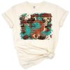 Aztec turquoise glitter cowhide western background with boho country styling.