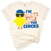 A playful design featuring a cartoon bunny and yellow chicks with Easter eggs.