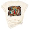 Boho style Virgin Mary artwork with cowhide pattern and floral accents.