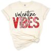 A vibrant leopard print tie dye design with playful Valentine’s Day elements.