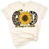 A western sunflower design with turquoise gemstones, leopard accents, and an inspirational faith quote.