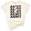 A distressed stacked design featuring baseball, t-ball, the word aunt, and a bold lightning bolt.
