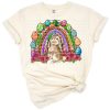A cheerful rainbow bunny with western accents surrounded by Easter-themed elements.