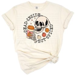 A skeleton holding a pumpkin spice coffee cup with fun fall accents.