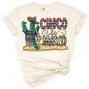 A colorful cactus with Mexican festive accents and western style.