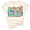 A western-style art teacher illustration with creative school-themed graphics and boho accents.