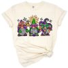 A cute gnome dressed in Mardi Gras colors with festive accessories and Louisiana carnival flair.