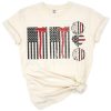Distressed American flag with firefighter badge and patriotic theme.