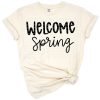 Hand-lettered welcome spring and Easter quotes with flowers and leaves in a cheerful arrangement.