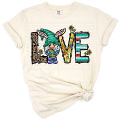 A cute Easter gnome with bunny ears holding a rabbit, surrounded by springtime elements.