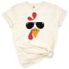 A colorful cartoon turkey face wearing cool sunglasses in a playful Thanksgiving style.