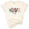 A love-themed design featuring a stethoscope heart with leopard, blush rose, and pale teal accents.