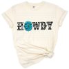 Retro western howdy phrase with cowhide print and turquoise gemstone accents.