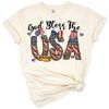 A turquoise cowhide print American flag with scripted God Bless America text and festive patriotic accents.