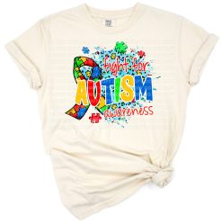 A colorful puzzle ribbon and heart with western-inspired accents and autism awareness theme.