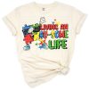 A bright multicolored puzzle heart with an uplifting awareness phrase.