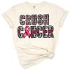 A bright pink ribbon with hand lettered words and motivational cancer awareness accents.