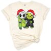 A retro cartoon green furry character in a festive holiday pose with Christmas accents.
