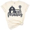 A rustic illustration of a farm boy with a tractor, barn, and windmill in a rural setting.